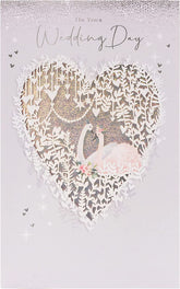 UK Greetings wedding day greeting card featuring a beautiful swan design with silver foil finishes, elegant and suitable for weddings.