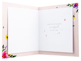 UK Greetings birthday card featuring colorful designs, perfect for celebrating special occasions with a cheerful greeting.