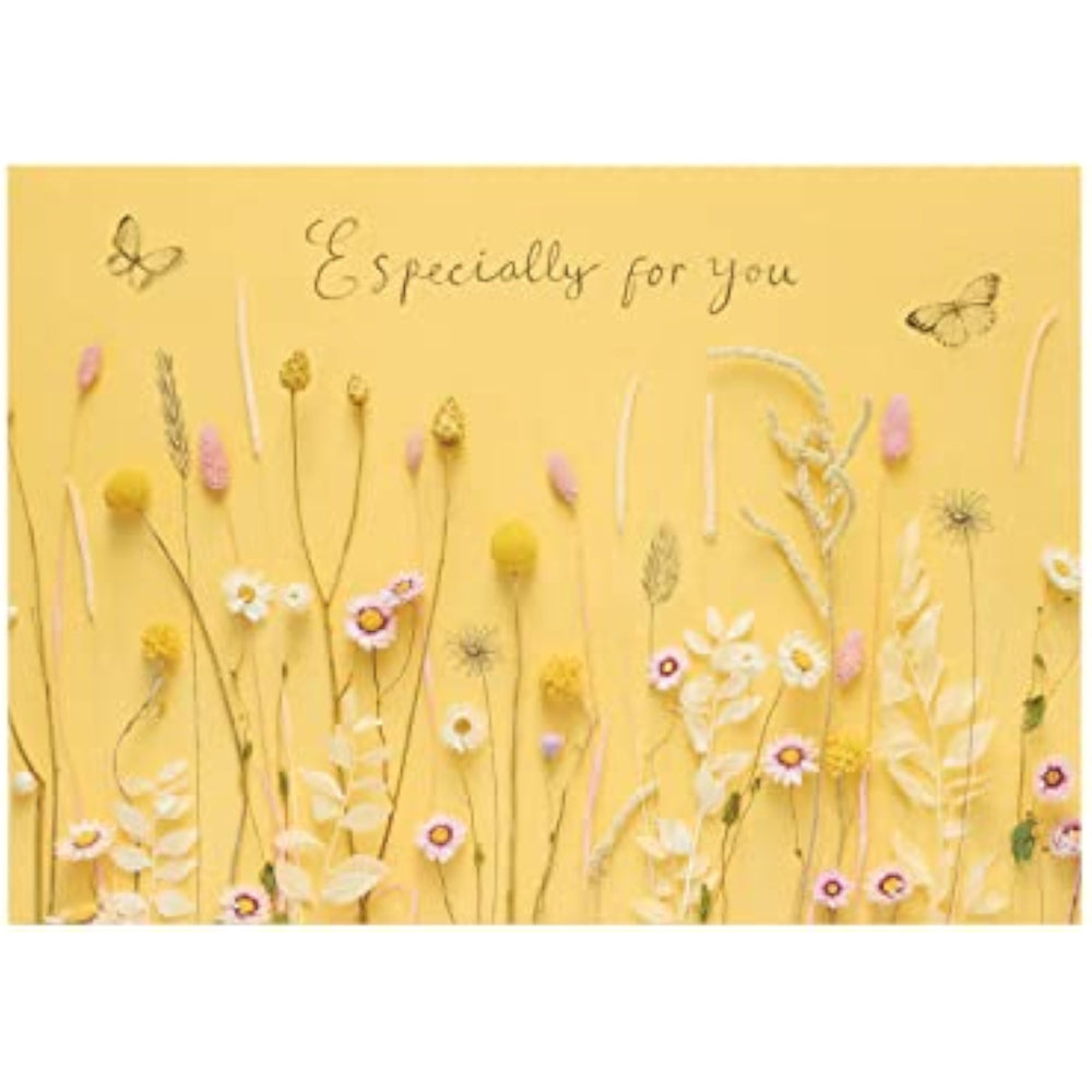 UK Greetings birthday card for her featuring a warm flower design, includes envelope, perfect for female friends.