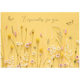 UK Greetings birthday card for her featuring a warm flower design, includes envelope, perfect for female friends.