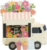 UK Greetings birthday card for Mum with pop-up flower truck design, featuring colorful floral artwork and festive details.