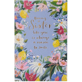 UK Greetings birthday card for sister featuring a floral border design, perfect for celebrating special occasions with a loved one.