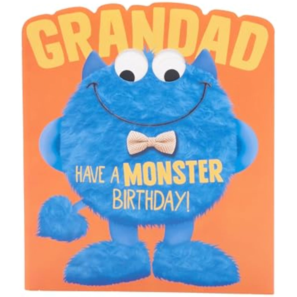 Blue googly-eyed monster greeting card for Grandad from UK Greetings, featuring colorful cartoon character and birthday message.
