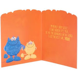 UK Greetings Blue Googly-Eyed Monster Grandad Birthday Card showing a colorful monster with googly eyes and festive birthday design
