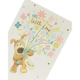 UK Greetings Boofle holding flowers birthday card showcasing a cute cartoon character with colorful floral design.