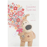 UK Greetings Boofle holding flowers birthday card featuring cute character, perfect for someone special, greeting card for birthdays.