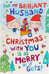 UK Greetings cartoon couple and festive scene Christmas card, featuring colorful holiday-themed illustrations.
