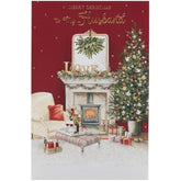 UK Greetings Christmas card for husband featuring a cozy festive scene with holiday decorations and warm seasonal imagery.