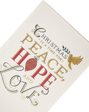 UK Greetings religious Christmas card featuring a peaceful holiday message with festive design and holiday symbols.