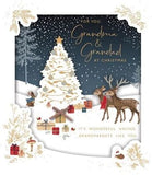 UK Greetings Christmas Scene greeting card featuring Grandma and Grandad with festive holiday design and cheerful Christmas imagery.