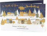 UK Greetings Christmas Town Scene greeting card showing festive holiday scene with a snowy town and holiday decorations.