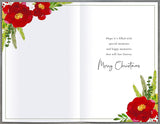 Watercolor Christmas wreath greeting card with holly and ivy designs by UK Greetings, featuring festive holiday message.