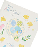 UK Greetings cute Easter card featuring colorful chicks and spring design, perfect for sending warm holiday wishes.