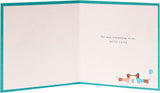 UK Greetings cute sausage dog birthday card featuring a charming design for husbands, perfect for celebrating special occasions.