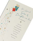 UK Greetings Daydreams dual presents Christmas card featuring son and daughter-in-law, with festive holiday design.