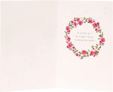 UK Greetings wedding greeting card with detailed floral design, featuring elegant patterns suitable for special wedding occasions.