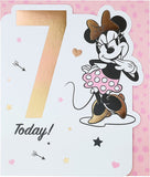 UK Greetings Disney Minnie Mouse birthday greeting card for age 7, featuring colorful Minnie Mouse illustration on the front.