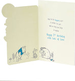 UK Greetings Disney Winnie the Pooh baby boy 1st birthday card with colorful cartoon Winnie the Pooh and playful design.