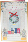 UK Greetings Christmas greeting card featuring a doorway with a wreath, for son and daughter-in-law, festive holiday design