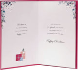 UK Greetings Christmas card featuring a doorway with wreath design for son and daughter-in-law, holiday greeting card image