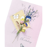 UK Greetings embossed birthday card with a cute floral design from the Meadow range, featuring detailed floral patterns and textured embossing.