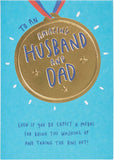 UK Greetings Father's Day card for husband or dad featuring a gold medal design, celebrating special moments with heartfelt messages.