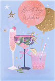 UK Greetings floral cocktail birthday card featuring colorful floral and cocktail illustrations on a greeting card design.