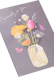 UK Greetings flower in jar birthday card featuring colorful floral illustration on a greeting card for special occasions.