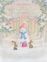 UK Greetings Christmas card featuring a snowman design for a wonderful granddaughter, perfect for holiday greeting cards.