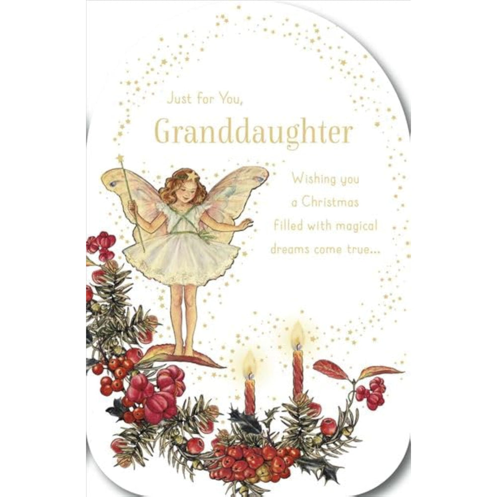 UK Greetings granddaughter Christmas card featuring a fairy girl, stars, candles, foil accents, and embossed details.