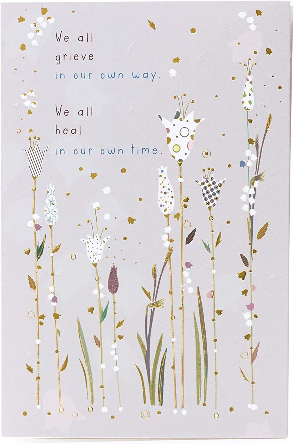 UK Greetings sympathy card titled "Grieve in Our Own Way" with caring thoughts and comforting message on a heartfelt greeting card.