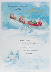 UK Greetings Christmas card featuring a Santa and sleigh design for husbands, festive holiday greeting card with holiday scene.