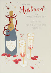 UK Greetings husband Valentine's Day card with envelope featuring an elegant champagne design, perfect for expressing love.