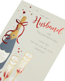 UK Greetings husband Valentine's Day card with champagne design and envelope, featuring romantic greeting and elegant artwork.