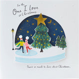 UK Greetings romantic Christmas card featuring ice skaters in a snow globe design, perfect for expressing love during the holidays.