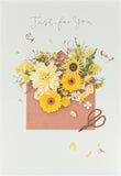UK Greetings floral birthday card featuring colorful floral design, perfect for celebrating special occasions.