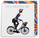 UK Greetings Kindred X Afrotouch greeting card featuring colorful artwork and the message "Life Is a Beautiful Ride."