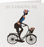 UK Greetings Kindred X Afrotouch greeting card featuring vibrant "Life Is a Beautiful Ride" design with colorful illustrations.