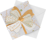 UK Greetings luxury pop-up money wallet gift card holder with an elegant gold bow design, showcasing a festive greeting card.