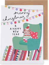 UK Greetings Christmas card with festive holiday design, featuring "Merry Christmas & a Happy New Year" message.