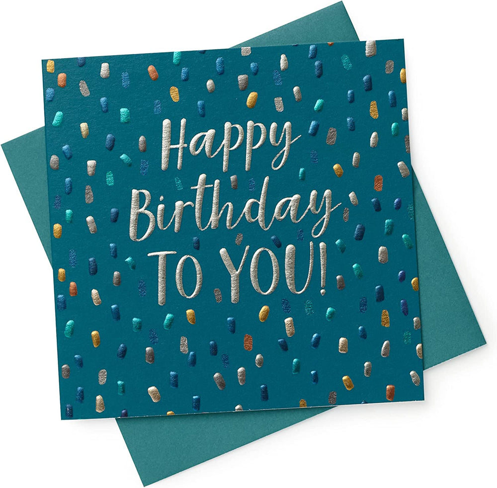 UK Greetings metallic foil dots male birthday celebration card featuring colorful dotted design and festive lettering on a greeting card.