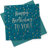 UK Greetings metallic foil dots male birthday celebration card featuring colorful dotted design and festive lettering on a greeting card.