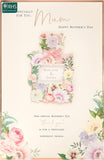 UK Greetings Mother's Day card with envelope featuring a pretty perfume design in white, measuring 194 x 295mm.