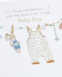 UK Greetings New Baby Boy greeting card with washing line design, featuring adorable baby-themed illustrations on the front.