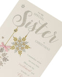 Off-white Christmas card for sister by UK Greetings, featuring festive holiday design and heartfelt message inside.