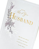 UK Greetings sympathy card with gold foil details expressing condolences on the loss of a husband, featuring heartfelt design.