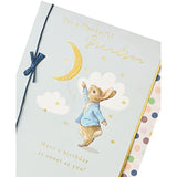 UK Greetings Peter Rabbit birthday card for grandson featuring a charming blue design and colorful illustrations.