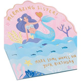UK Greetings pop-up mermaid sister birthday card featuring a colorful, intricate mermaid design for special celebrations.