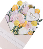 UK Greetings pop-up Mother's Day card featuring a colorful nan-themed design with festive illustrations.