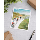 UK Greetings scenic cycling birthday card for him, featuring a detailed illustration of a cyclist on a scenic route.